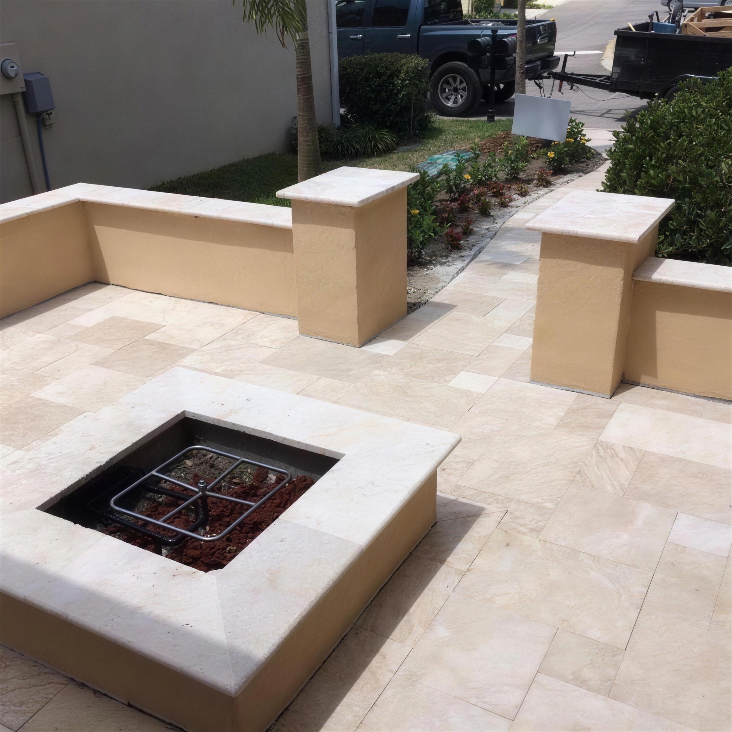 Sealed travertine patio and fire pit in Brevard County